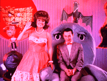 Miss Yvonne and Pee Wee from Pee Wee's Playhouse.